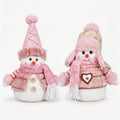 Pink Christmas snowman tabletop figurine décor with pink hats and scarves